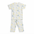 A professional studio flat-lay photograph of a kids' white short-sleeve t-shirt and matching pajama pants featuring a colorful celestial sun, moon, and planet print on a pure white background.