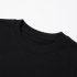 Close-up of black cotton t-shirt and blue side panel seam stitching - Co Kids Wear