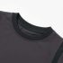 Close-up of charcoal grey cotton fabric texture and side panel seam - Co Kids Wear
