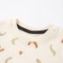 Close-up of abstract geometric pattern and soft cotton collar texture - Co Kids Wear